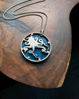 Tuvalu - Octopus Cut Coin Pendant with Blue Background