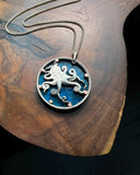 Tuvalu - Octopus Cut Coin Pendant with Blue Background