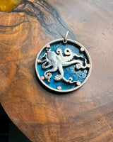 Tuvalu - Octopus Cut Coin Pendant with Blue Background