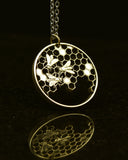 Slovakia - Cut Coin Pendant with Bees on a Honeycomb